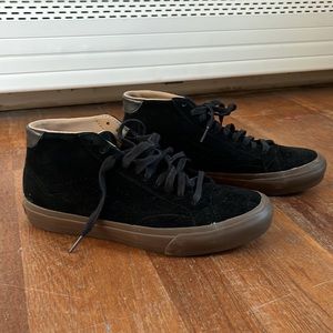 Black vans with brown sole. Basically brand new!